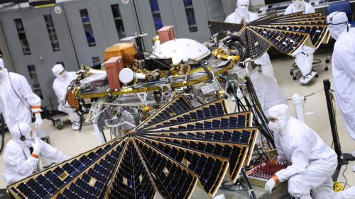 Lockheed Martin technicians working on the InSight Mars rover on the factory floor